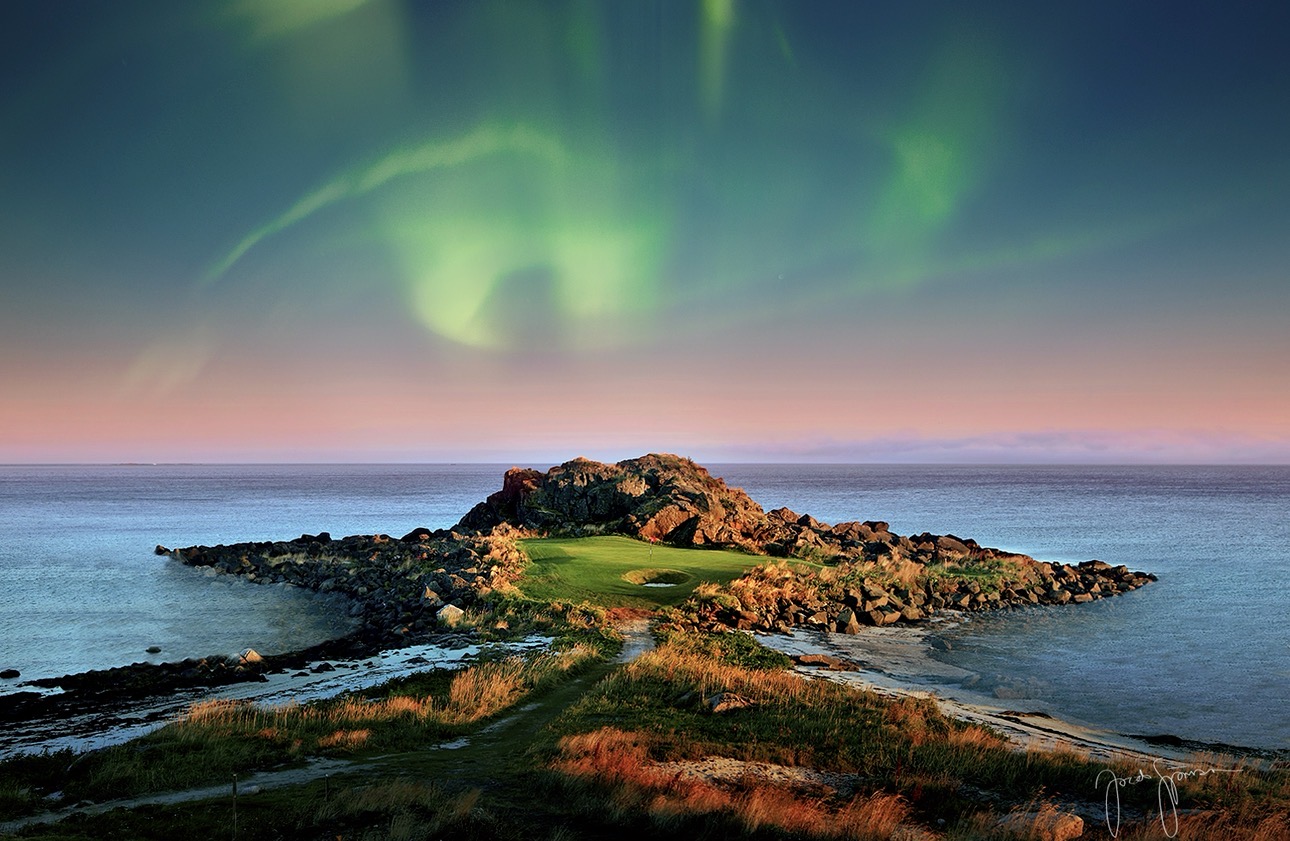 Seaside links green under the northern lights