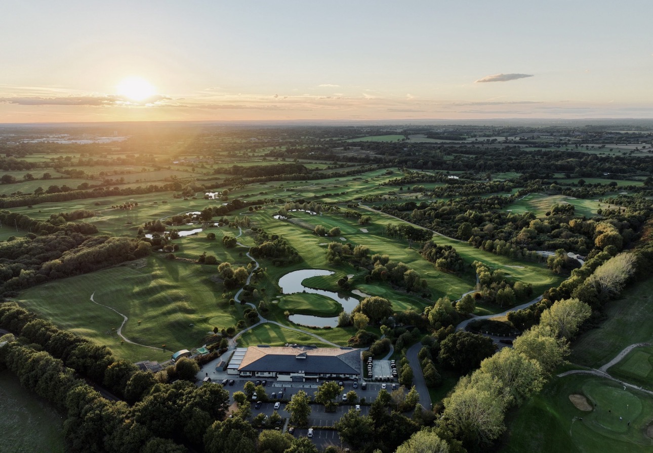 The Shire London golf course from the air at sunset